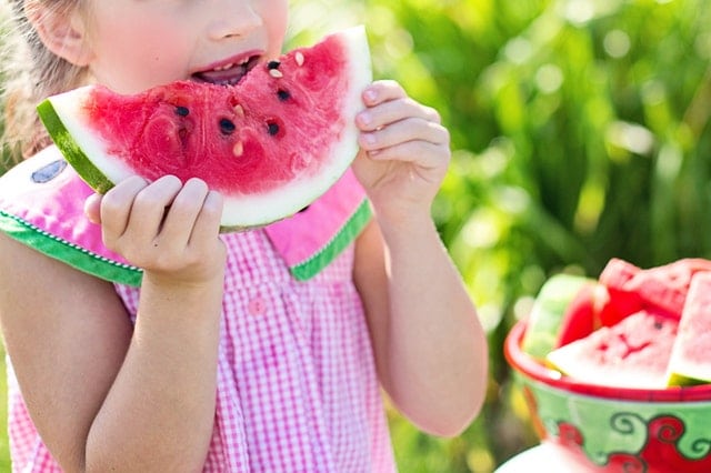 Summer Hearing Protection in San Francisco Young Girl Eating Watermelon -San Francisco