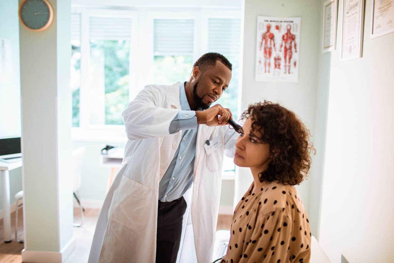 Woman gets a hearing exam.