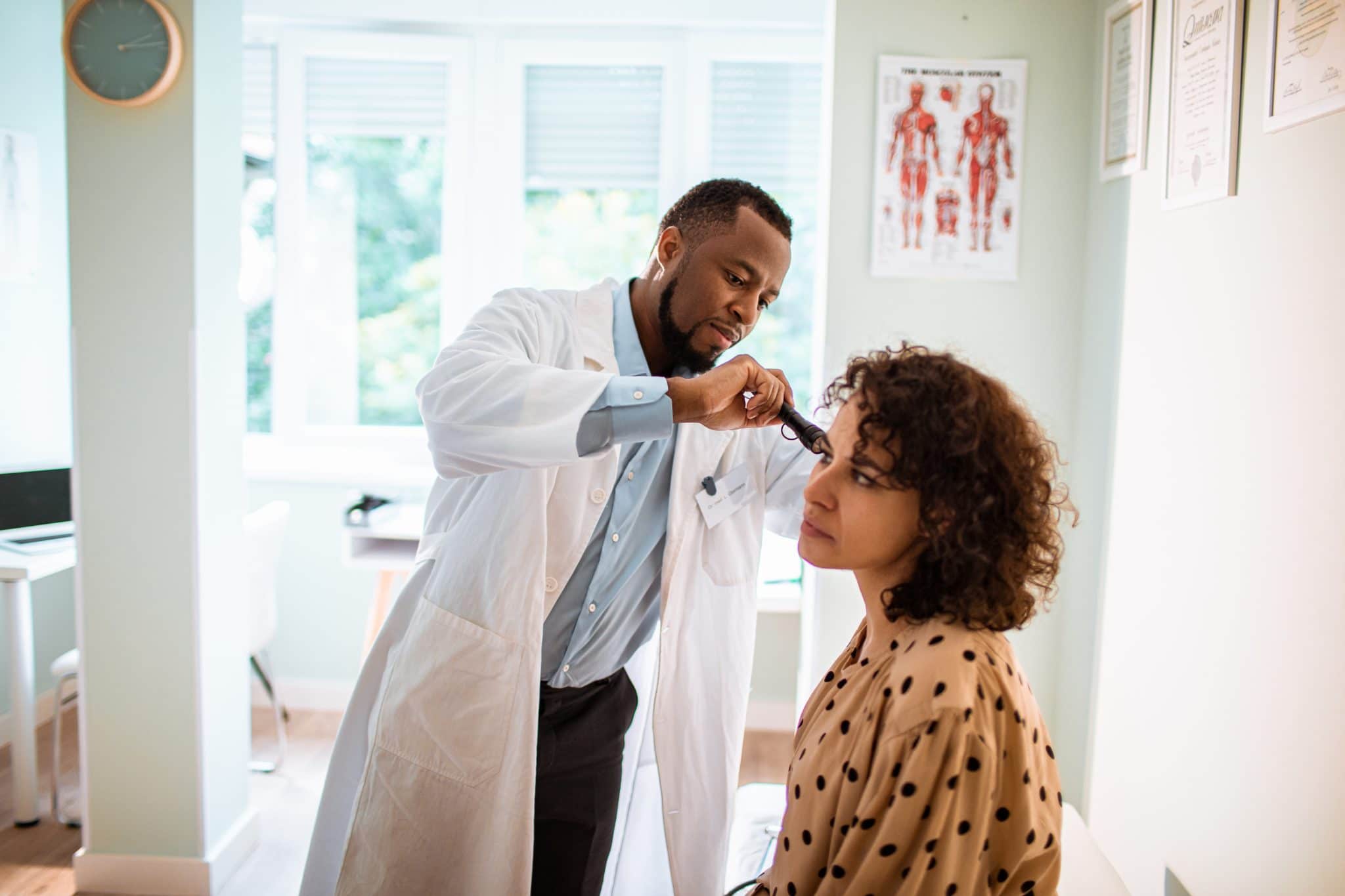 Woman gets a hearing exam.