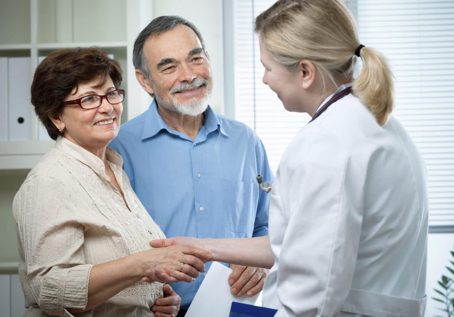 Hearing Aid Counseling and Fitting Couple Receiving Hearing Aid Counseling From a hearing care provider During a Fitting