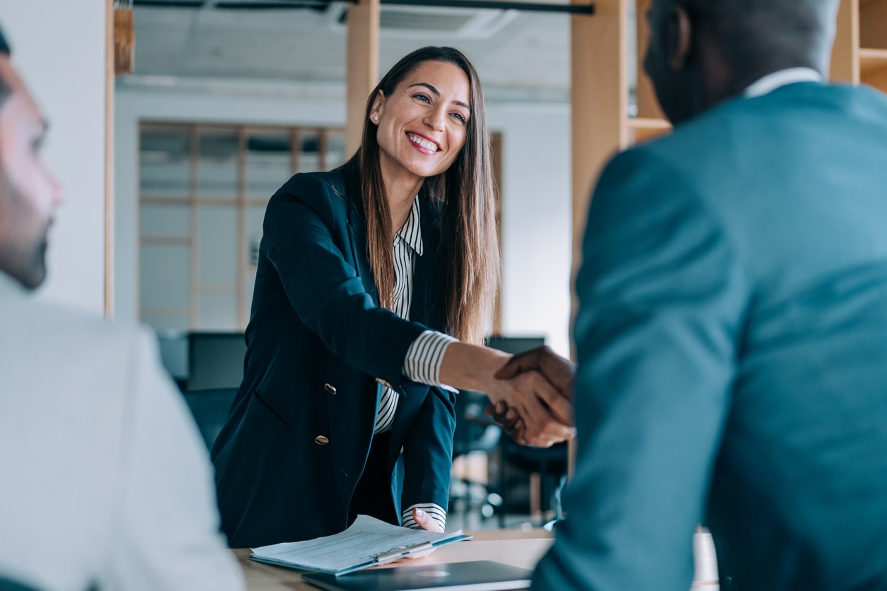 Woman shaking hands with her interviewer