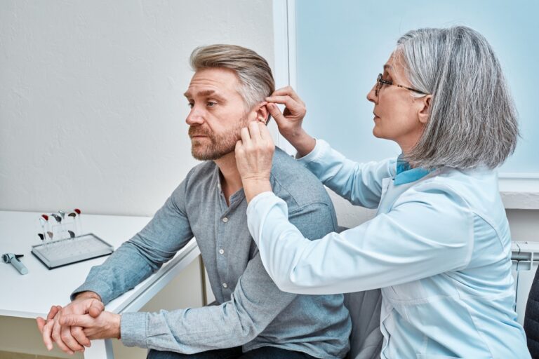Man is fitted with hearing aids